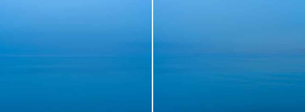 Lake Michigan appears slowly out of the fog on a foggy blue morning in this diptych from the Lake Series Panorama Collection from February of 2019.