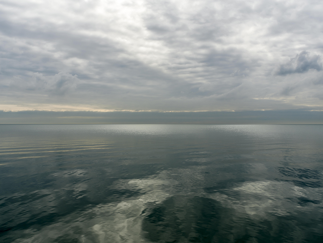 The lake appears in emerald greens in this photograph from the Lake Series, July 5th, 2016 (2). Often in the morning the lake will transform quite rapidly in character as the sun climbs in the sky. The lake and sky are always in fluctuation. It is that mercurial quality that brings me back again and again to photograph this series.