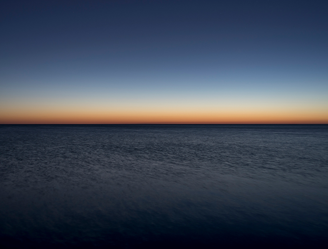 First light on Lake Michigan in this photograph, Lake Series, October 8th, 2017 (1). Here, you can see dawn just beginning to evidence itself in the landscape. The horizon line is the first place to see the warm light of day.