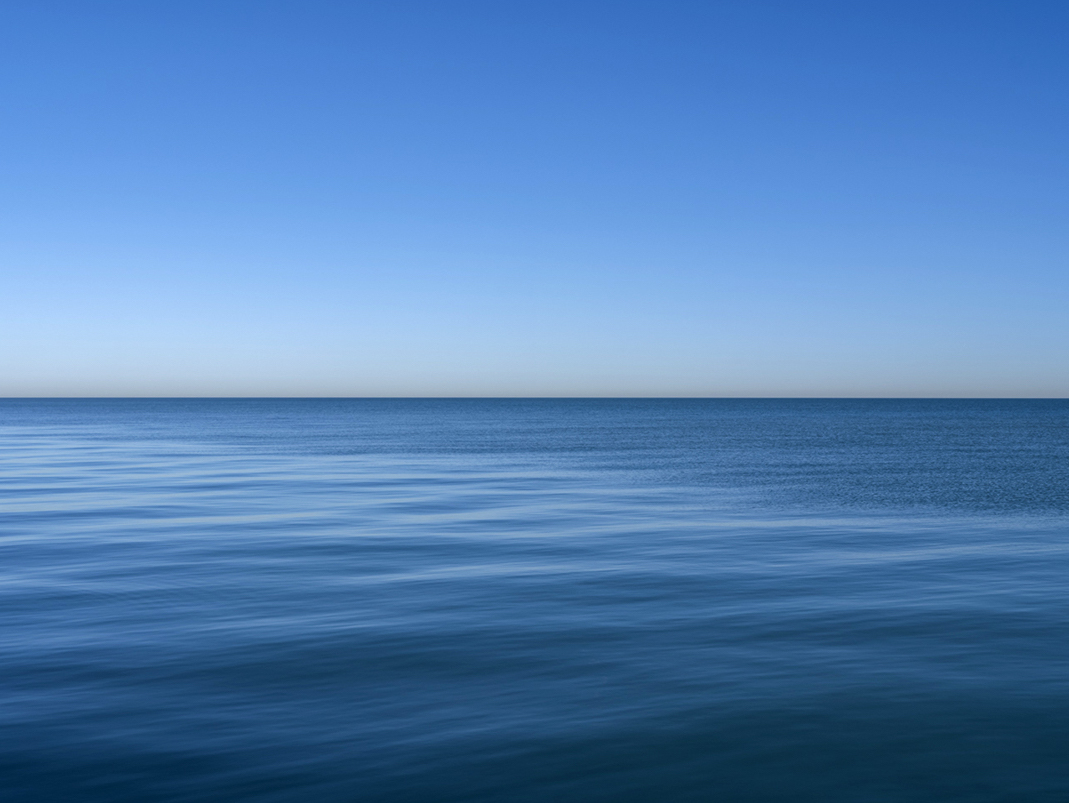 Lake Michigan is an icy blue in this photograph from the Lake Series, November 13th, 2023. True winter conditions remain elusive this year, with warmer temperatures extending well into December.