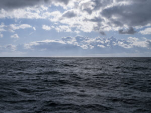 Lake Michigan on a stormy day where clouds are beginning to fill the sky over the lake waters.