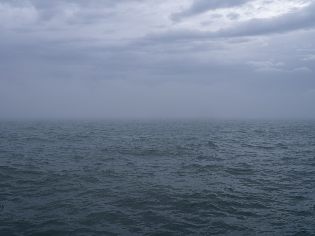 A foggy morning over Lake Michigan from March 14th, 2024. March this year was filled with cold rain and damp conditions often similar to those seen in this photograph from the Lake Series. There is a softness to the light that comes with these days that gently shapes the landscape's contours.