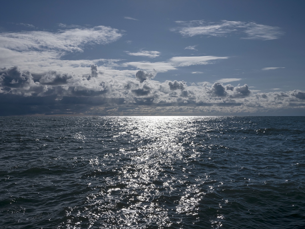 It's fall and on Lake Michigan the sun reflects the later season. The light is no longer so direct or sharp in nature, summer faded to fall. This photograph from the Lake Series, is September 18th, 2023.
