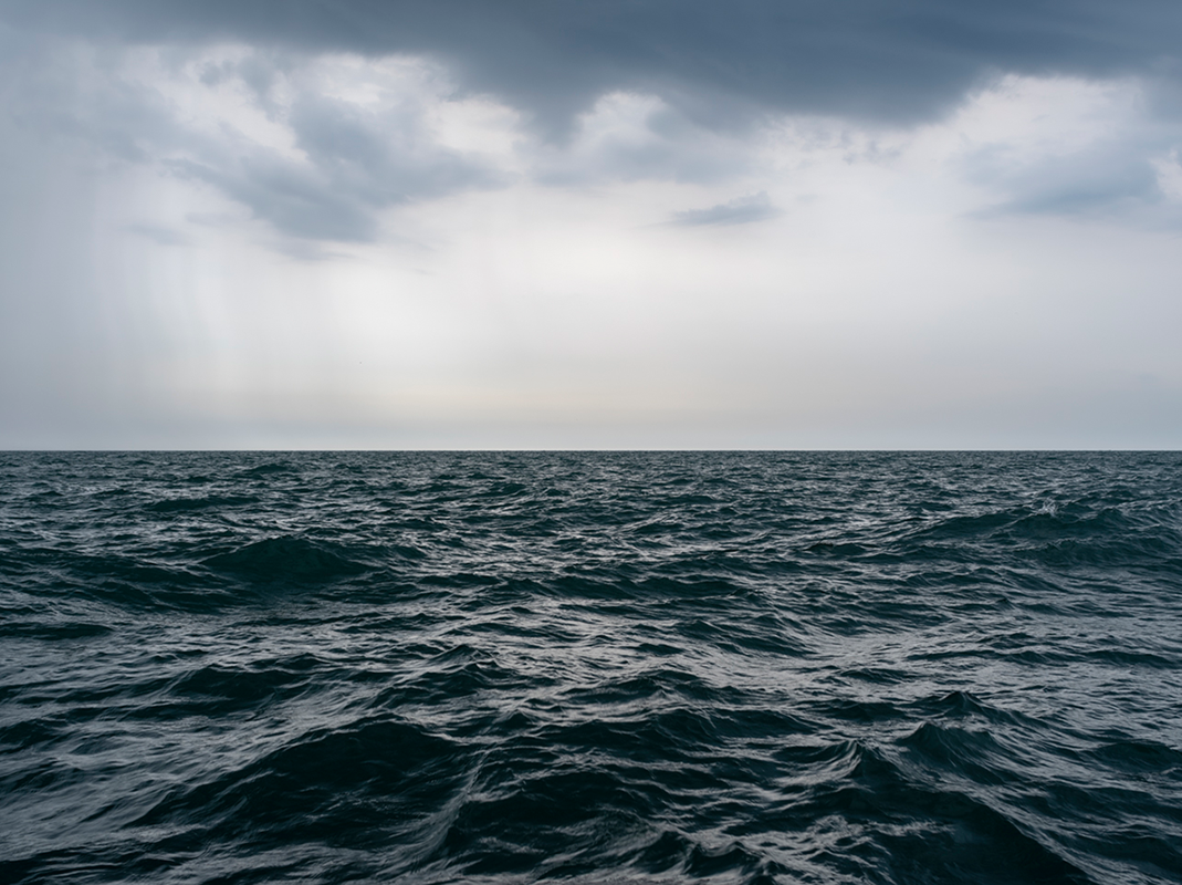 The lake is filled with large and powerful waves building in size in the black as ink water before my eyes in size on this June 8th, 2018 morning. Soon these storms will cause Lake Michigan to crash and push at the shorelines, a reminder of the intensity this freshwater body of water can possess.