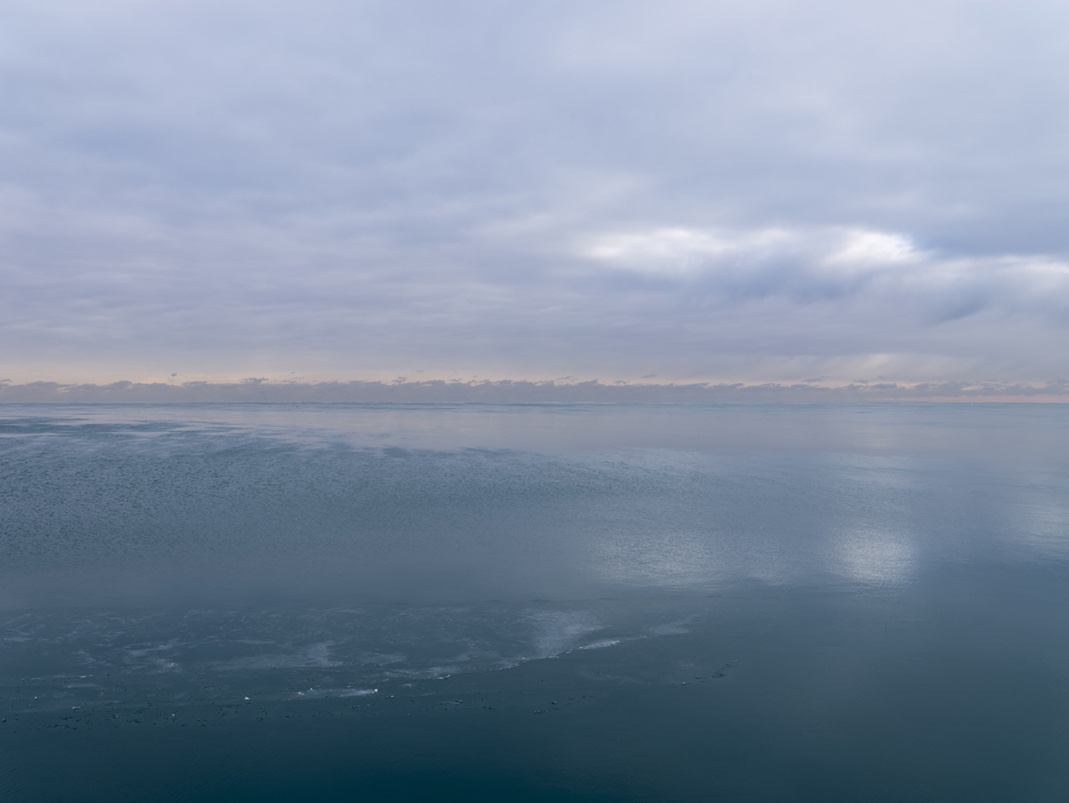 A January morning on the lake . This photograph, January 17th, 2024 is from the Lake Series, a limited edition of prints from Lincoln Schatz. Here, on this mid January day, ice forms on Lake Michigan.