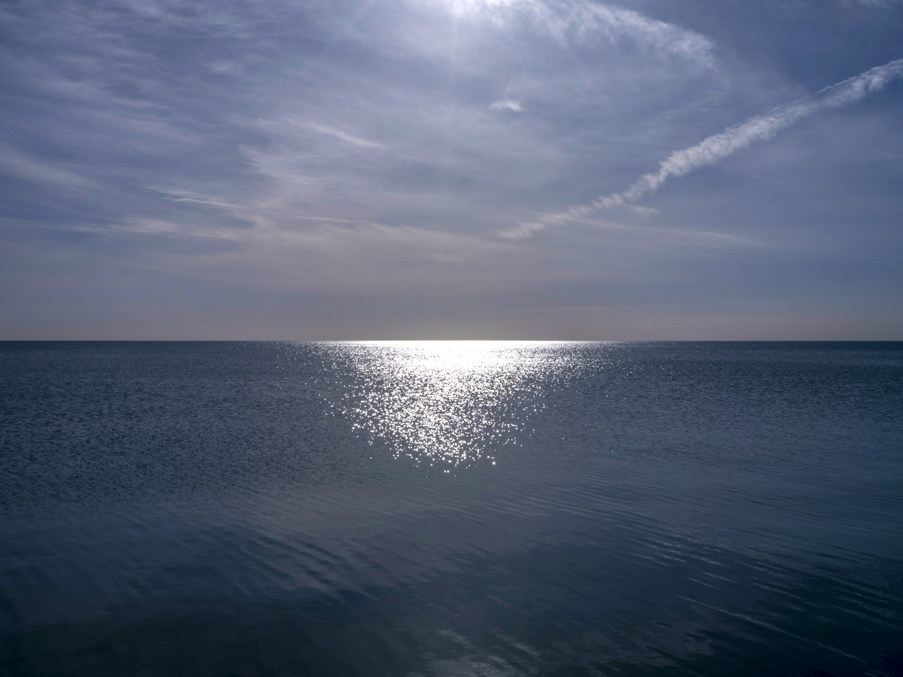 An excerpt from November Sunday Morning by the poet Alvin Feinman on a Sunday morning from Lake Michigan.