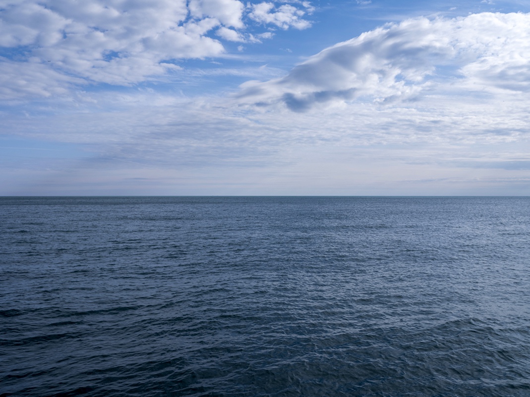 A soft early April day that gently ushers us closer to spring on Lake Michigan. These transitional days have a newness of life that is undeniable. Plants are erupting from the sand and soil along the edges of Lake Michigan. A fast flush of dandelions are now already fully gone to seed. The seasons this year seem rushed, the weather too warm, too quick and a calm day like this allows for that pace to slow down, to appreciate spring for what it is, if only for a few hours. This is April 12th, 2024, from the Lake Series.
