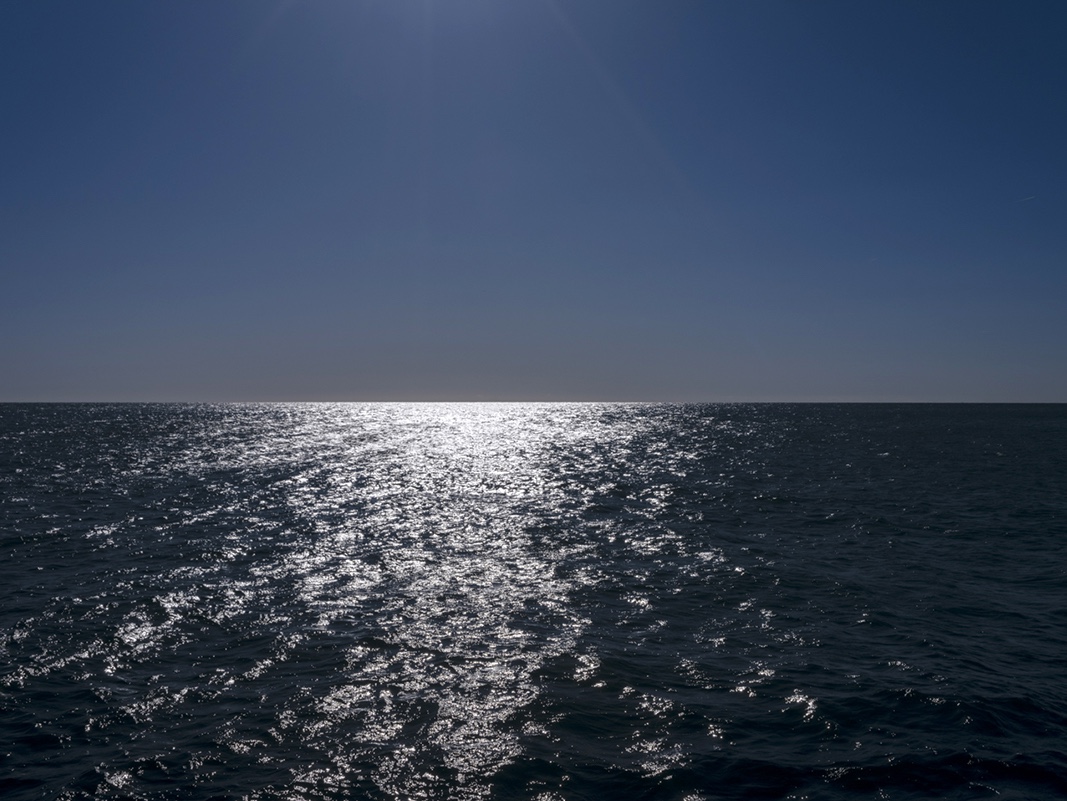 Water, a poem by Ralph Waldo Emerson alongside a day on Lake Michigan from April 19th, 2024 from the Lake Series.