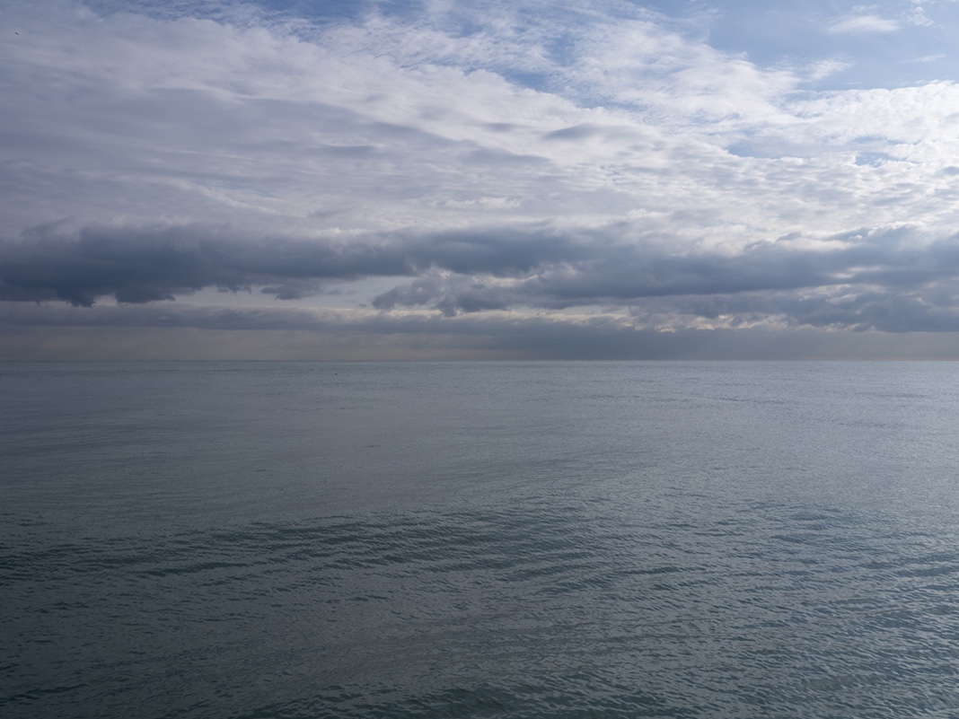 Clouds fill the sky over an almost placid Lake Michigan as I contemplate the relationship between Proust and the Lake.
