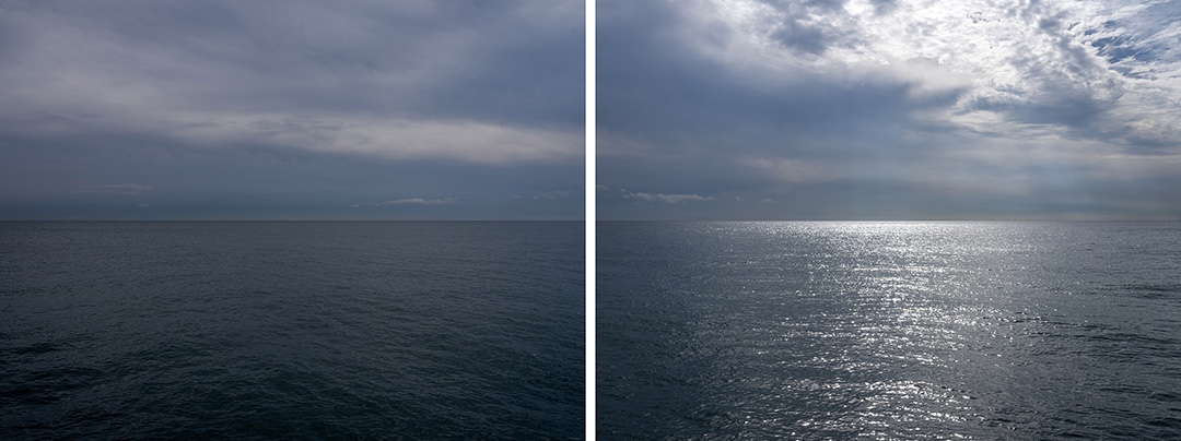 A photograph of a dark gray and blue Lake Michigan with heavy clouds in the sky from the Lake Vistas Edition.